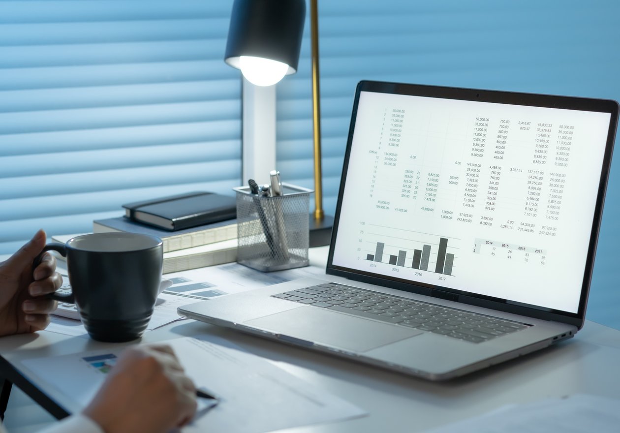 Insurance agent reviewing Performance Leads dashboard with client applications